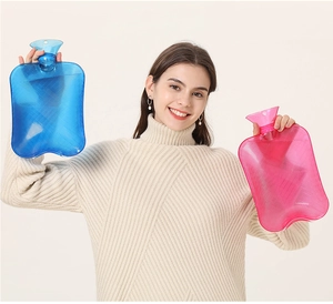 Detail of pink and blue PVC hot water bottles with non-slip stripes and screw caps