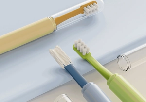 Detail view of silicone pet toothbrushes with multiple heads and clear travel cases