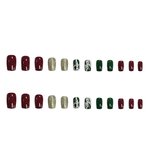 Christmas tree matte gold press-on nails set with red and green festive cartoon designs
