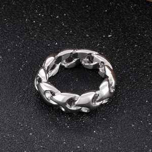 Macro shot of polished silver stainless steel chain ring with interconnected link texture