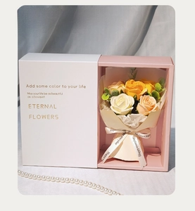 Detailed view of handmade soap rose bouquet in a pink drawer gift box with golden lettering
