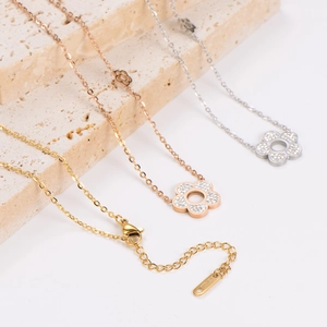 Sparkling zircon-encrusted flower necklaces in gold, rose gold and silver finishes