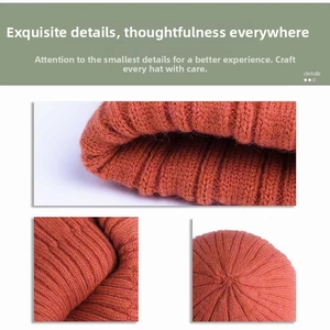 Detail view of the caramel orange knit beanie showing ribbed texture and stitching