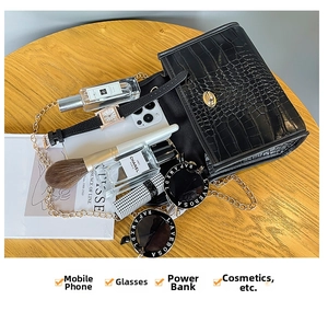 Detail view of black stone pattern leather handbag interior showing storage capacity