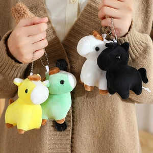 Set of colorful plush pony keychains in yellow, green, white, and black with metal chains