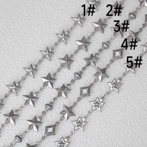 Macro detail of various stainless steel star and heart shaped DIY jewelry chains