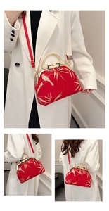 Detailed views of red Chinese style handbag with golden bird and bamboo embroidery