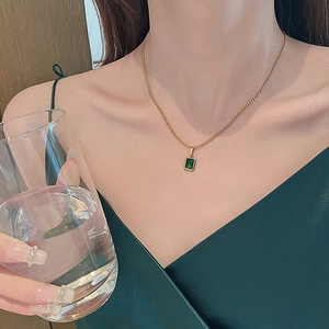 Vintage gold titanium steel necklace featuring a rectangular emerald green pendant charm