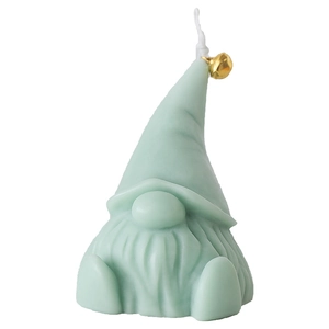 Handcrafted green Christmas gnome candle featuring a golden bell detail and white wick