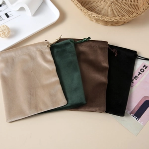 Detailed view of soft velvet drawstring jewelry pouches in four elegant colors