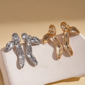 Textured gold and silver petal earrings with metallic pleated finish on stone base