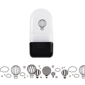 Close-up of animal roller stamp showing white plastic body and hot air balloon prints