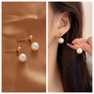 Close-up of pearl drop earrings on silk background and model showing fit and size