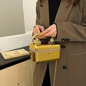 Glossy gold acrylic box evening bag with lion head handle and elegant chain strap