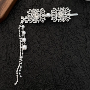Elegant silver flower hair clip with rhinestones, pearls, and a long tassel drop