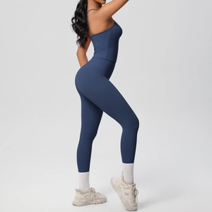 Detail view of dark blue two-piece yoga set showing slim fit fabric and seamless stitching