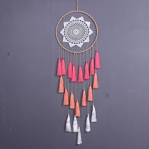 Handmade dream catcher wall hanging with white mesh and pink orange fringe tassels