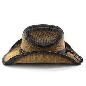 Detail of woven straw texture and black leather band with metal studs on cowboy hat