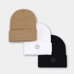Three-pack knitted beanies with sun embroidery in khaki, white, and black for winter