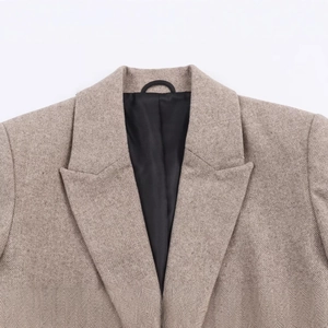 Women's casual herringbone wool blazer featuring a classic notch lapel in light khaki