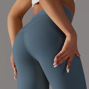 Close-up of high-waisted seamless yoga pants in matte blue fabric texture and fit