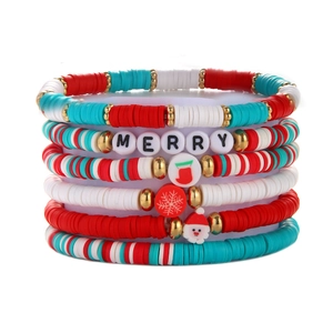 Detail of Christmas stackable bracelet set with MERRY beads and holiday charms