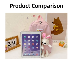 Pink cartoon children backpack with bunny plushie next to iPad for size comparison