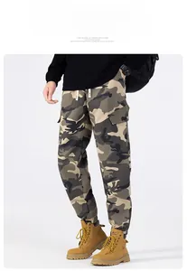 Detail view of camouflage cargo pants featuring large side pockets and drawstring waist