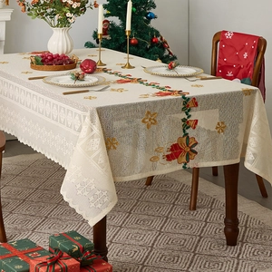 Festive beige Christmas tablecloth with lace edges, embroidery and holiday decorations