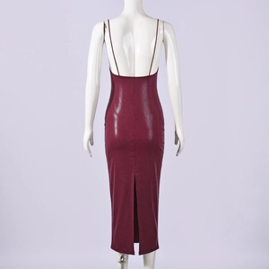 Back view of burgundy snake print bodycon dress with spaghetti straps and rear slit detail