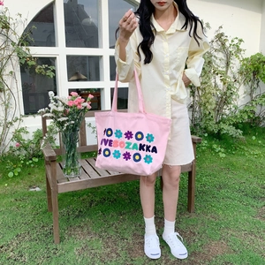 Pink canvas tote bag featuring intricate floral embroidery and LOVE SOZAKKA lettering