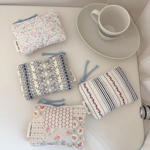 Set of four vintage floral quilted cotton pouches for coins and earphones with zippers