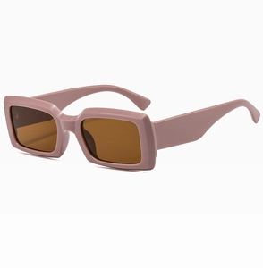 Side view of trendy rectangular thick frame sunglasses in dusty pink with tinted lenses