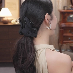 French vintage black satin double bow hair claw clip with beads on a model back view