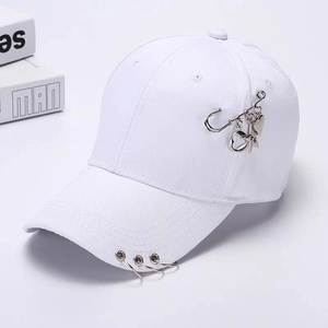 White cotton baseball cap featuring silver ring and heart star charms on the brim