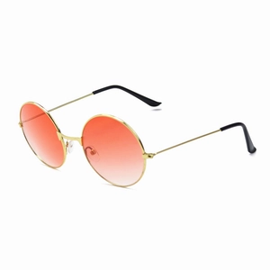 Detail of round sunglasses with orange gradient lenses and a thin golden metal frame