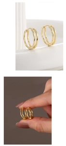 Detail of minimalist 14K gold plated S925 silver double hoop earrings with a polished finish