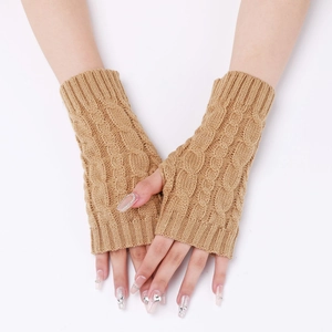 Close-up of camel knit fingerless gloves with cable stitch texture on model hands