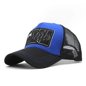 Detail shot of the royal blue front panel and mesh back of this casual trucker hat
