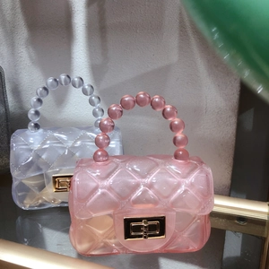 Chic quilted jelly crossbody bag with pearl handle and golden twist lock closure