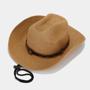 Western straw cowboy hat with leather band and adjustable chin cord on white background