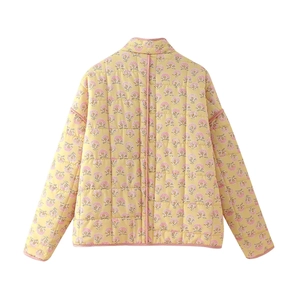 Detailed back view of a yellow floral quilted cotton jacket with pink flower print