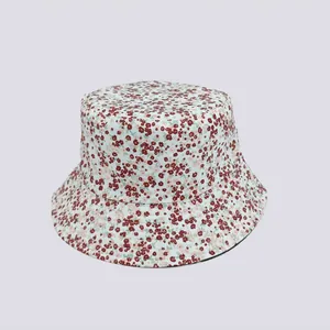 Detailed view of women's bucket hat with all-over floral print on cotton canvas fabric