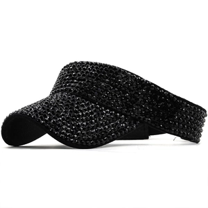 Detailed side view of black sun visor hat with sparkling rhinestones and open top