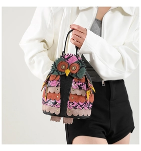 Fashionable owl-shaped crossbody bag featuring multi-colored PU leather with metallic details