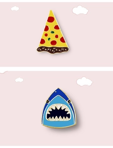 Cute enamel pizza and shark brooches with gold plating on a pink background