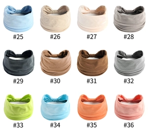Griglia di 12 fasce per capelli boho yoga colorate con un elegante design a nodo centrale