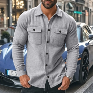 Outdoor close-up of grey fleece-lined casual shirt jacket with dual chest pockets and buttons