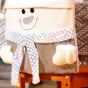 Detailed view of plush snowman chair cover with sequin scarf and soft fuzzy texture