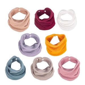 8-pack organic muslin cotton baby bibs set in various solid colors with snap buttons